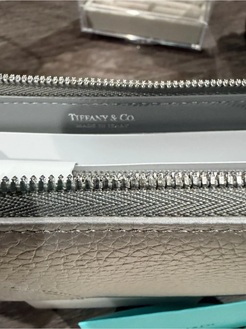 Tiffany & Co. Metallic Silver Zip-Around Pebbled Leather Wallet